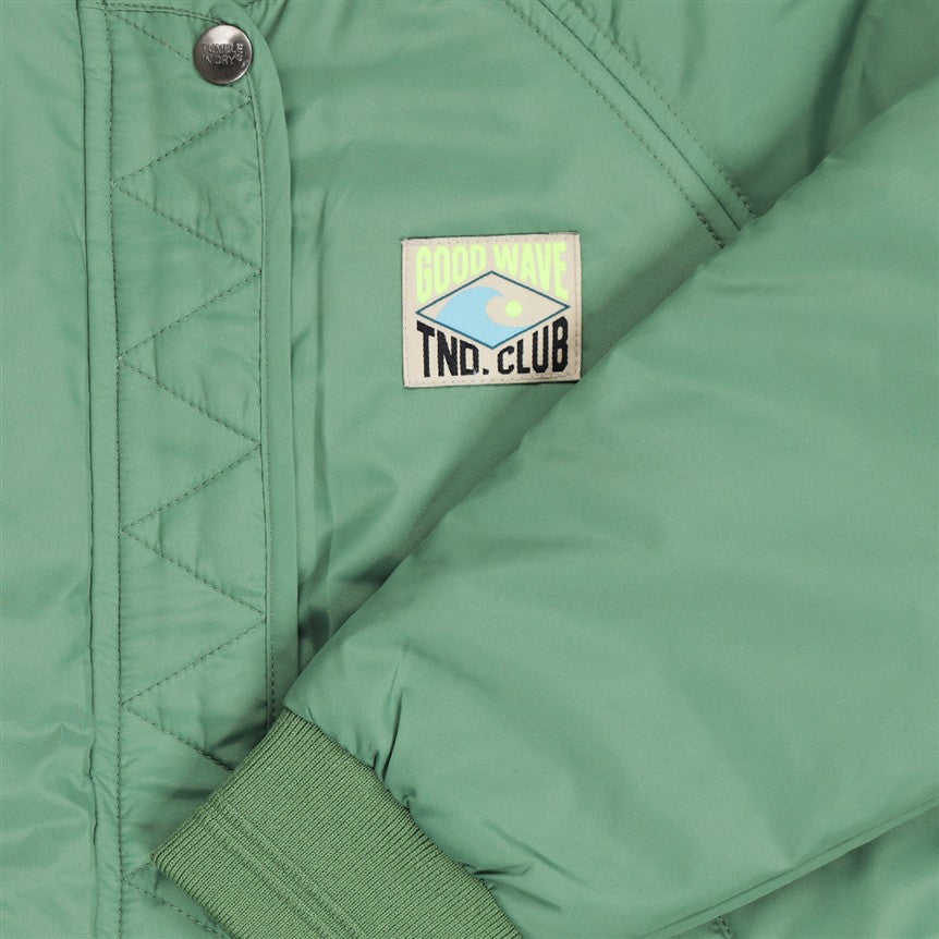 Detail groene stof bomber jas