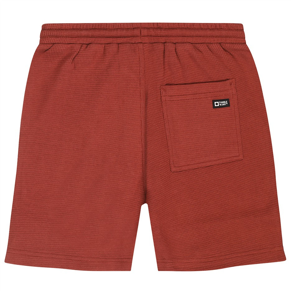 Achterkant bruine wafelkatoen kindershort met zakken van Tumble n Dry