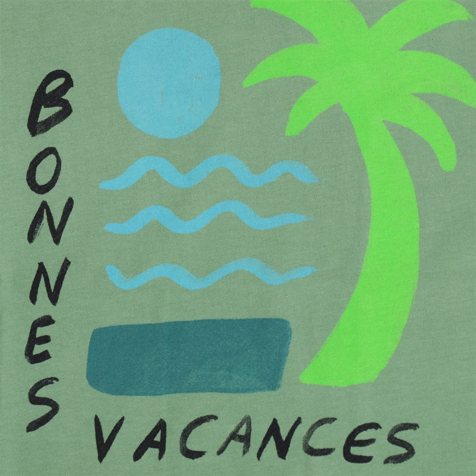 Detail palmboom en Bonnes Vacances opdruk
