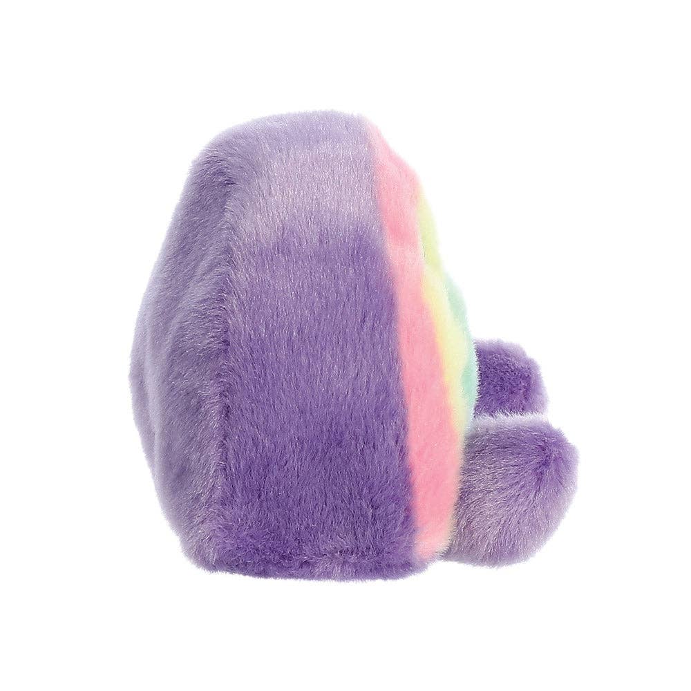 Klein pluche regenboogje met glimlach