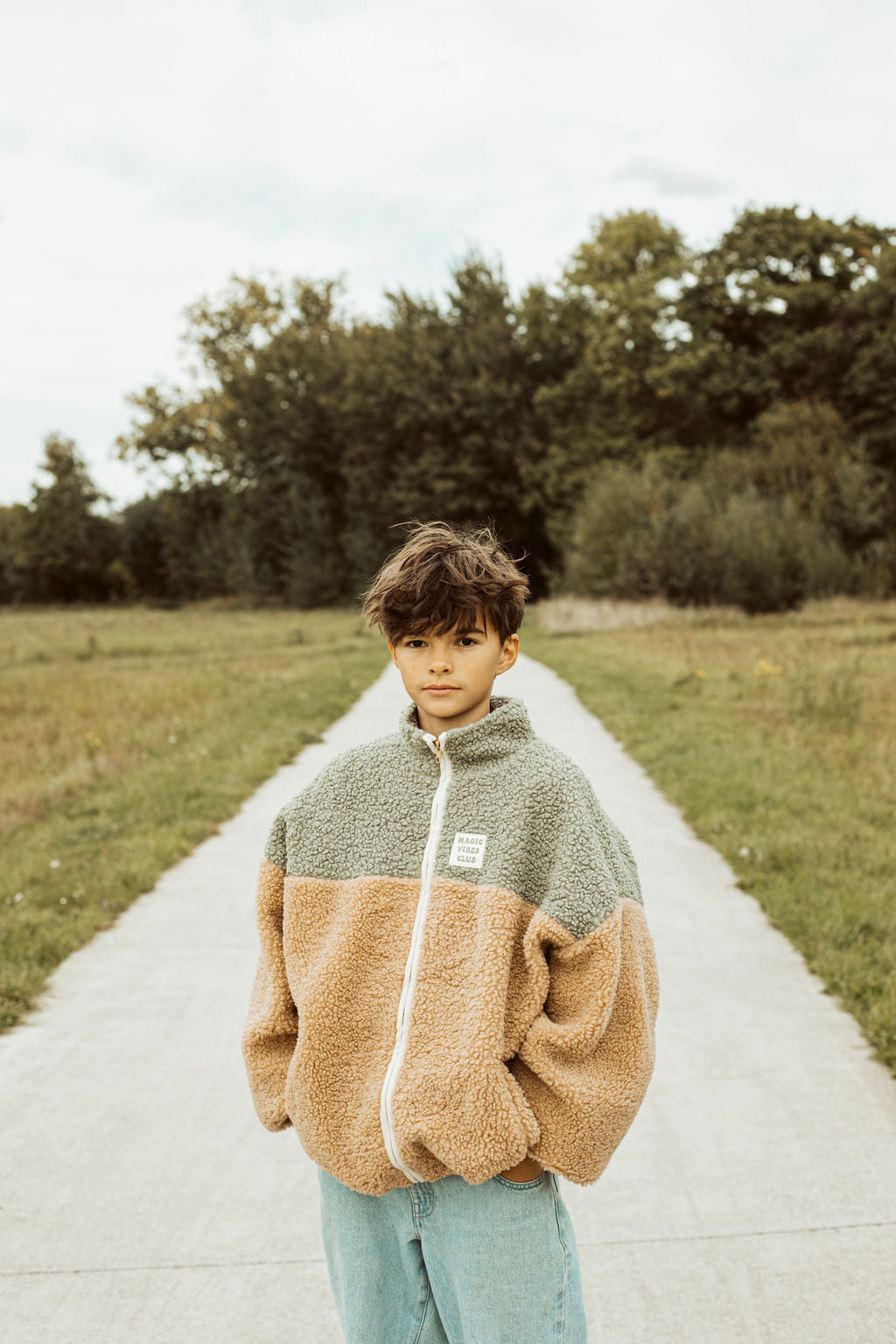 Teddy jas in groen en beige.