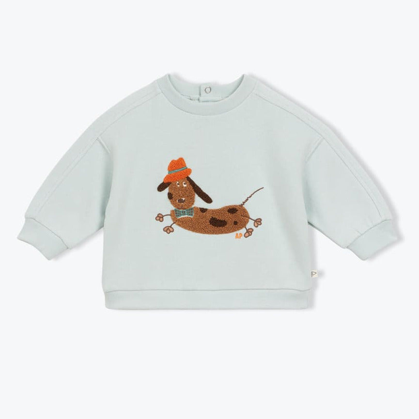 Lichtblauwe babysweater voor jongens met teckel flock patch.