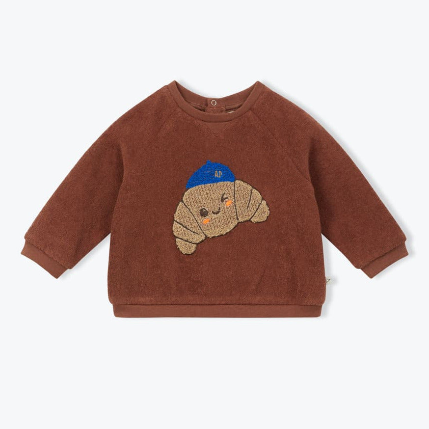 Bruine badstof baby sweater met croissant patch op de voorkant