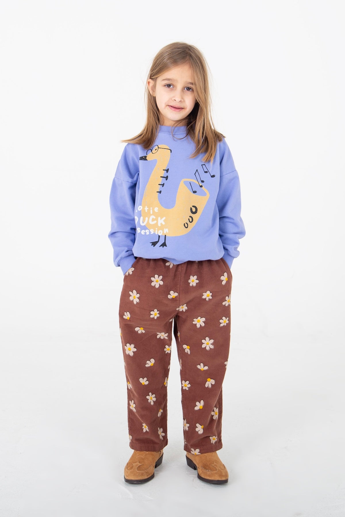 Paarse sweater voor kinderen met grappige muzikale eendenprint.