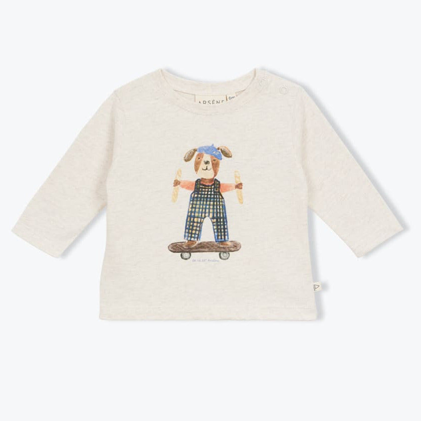 Ecru babyshirt met opdruk van een hondje op een skateboard van arséne et les pipelettes