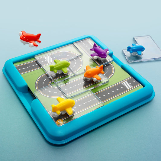 Take Off puzzelspel met vliegtuigen en opdrachten waarbij routes en posities correct moeten worden gelegd op een speelbord.