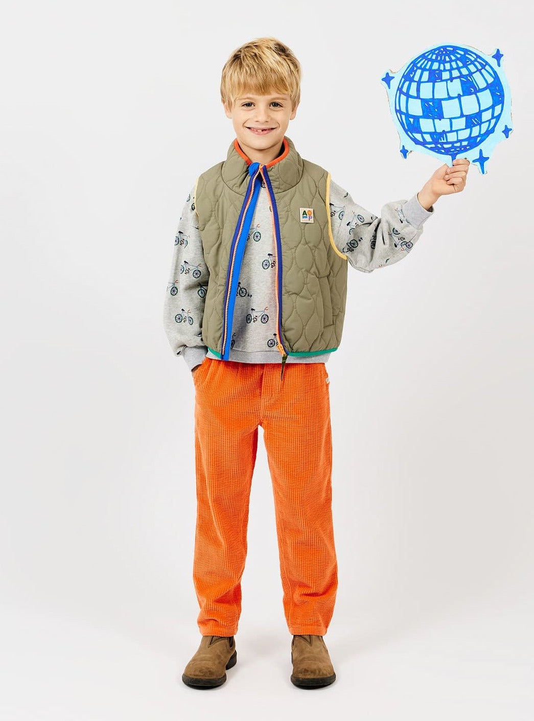 Warme oranje broek van zacht ribfluweel.