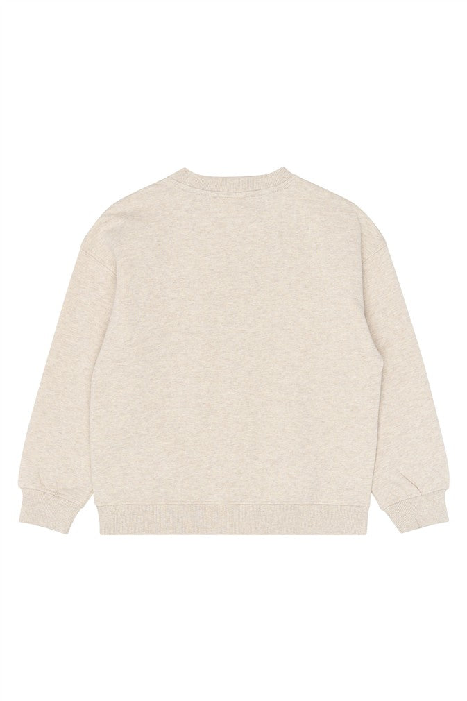 Achterzijde van de beige gemêleerde meisjes sweater zonder print.