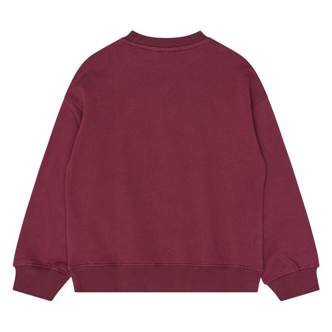 Achterzijde van de bordeauxrode meisjes sweater zonder print.